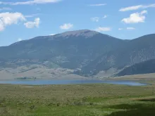 Eagle Nest Lake on the Enchanted Circle, with the mountains of the Moreno Valley rising behind it.