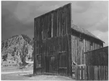 A weathered false-front wooden store building in Red River, photographed by Ernest Knee in 1934.