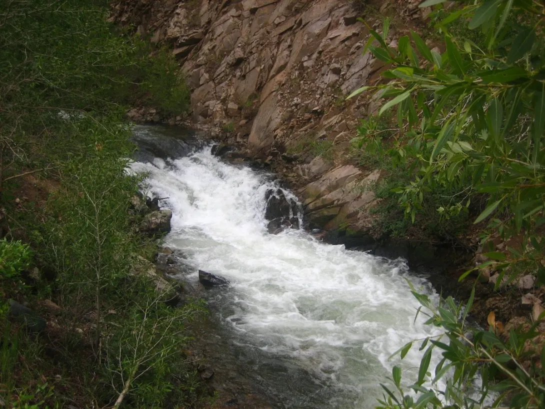 The Red River rushing through its rocky canyon, in the country below the Bitter Creek gold camps of Midnight and Anchor.